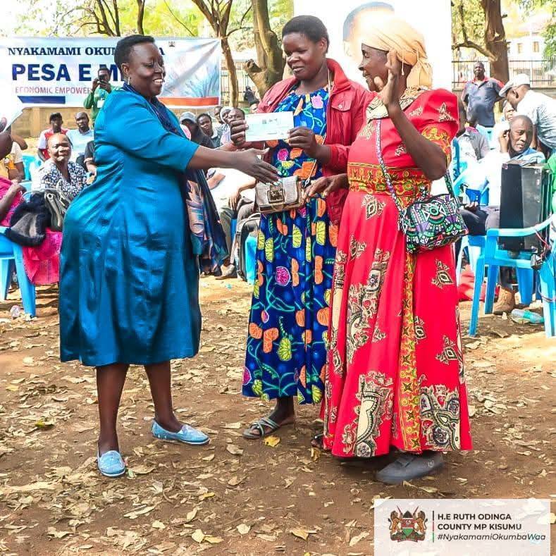 Nyakamami Foundation Founder Hon Ruth Odinga issuing cheques to groups in Kisumu
